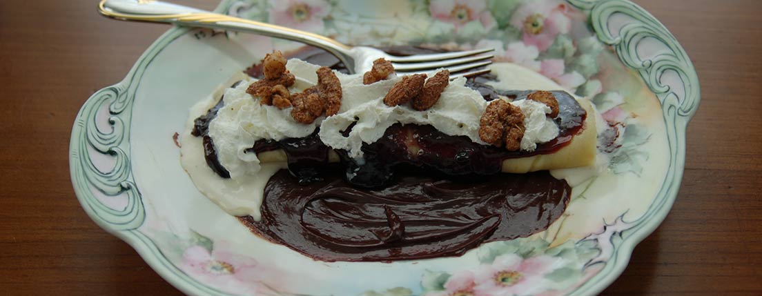 crepe with blackberry cinnz jam and whipped cream